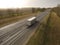 Aerial Top View of White Truck with Cargo Semi Trailer Moving on