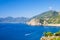 Aerial top view of white yacht sail on water of Ligurian Sea near coastline of Riviera di Levante, National park Cinque Terre Coas