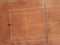 Aerial top view of a young female tennis player playing on brown ground court. Professional girl tennis player hitting a