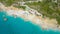 AERIAL: Tourists enjoying their summer vacation on the scenic beach on Lefkada.