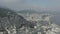 Aerial, tracking shot of Copacabana and favelas on the hills of Rio de Janeiro