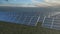 Aerial tracking shot of a solar farm.