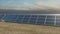 Aerial tracking shot of a solar farm.