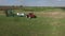 Aerial, - Tractor with four furrow plough plowing a field