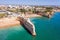 Aerial from the traditional church `Senora de Nossa` at Armacao the Pera in the Algarve Portugal at sunset