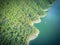 Aerial trees and cliff rock wall crystal water at Lake Travis, A