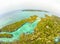 Aerial: tropical paradise pristine coast line rainforest blue lake at Bair Island. Indonesia Moluccas archipelago, Kei Islands,