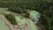 Aerial: Turquoise river Katun flowing in a mountain valley