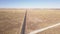 Aerial of two roads in a wide open landscape