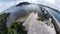 aerial ultra-wide panoramic view on the concrete highway bridge across the coastline.