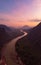 Aerial unique view from drone: Nam Ou river valley at Muang Ngoi Laos, sunset colorful sky, dramatic mountain landscape, travel