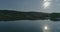 AERIAL. Unveiling drone shot of the lake in Lithuania on a sunny day