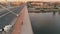 Aerial Urban Shot of Woman Riding Bicycle on Bridge in Warsaw City in Morning