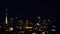 Aerial urban view of Auckland financial center skyline CBD with the Sky Tower at night.