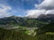 Aerial of Val Gardena from Ciampinoi in GrÃ¶den. Stevia and Seceda in the Background and Forest and Trees in the foreground. Drone