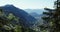 Aerial of Val Gardena, GrÃ¶den in South Tirol. Flying between trees revealing alpine town