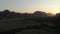 Aerial: Vang Vieng backpacker travel destination in Laos, Asia. Hot air balloons at sunset scenic cliffs rock pinnacles rice paddi