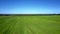 Aerial vast agro field landscape under blue sky