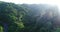 Aerial video above tropical forest in sunny day