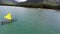 Aerial video of catamaran riders off tropical island