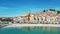 Aerial video of colorful bright buildings on the sea shore, Menton Commune in France