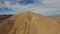 Aerial video of desert landscape and wind power