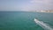 Aerial video with drone over the sea and the beach with boats and yachts
