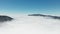 Aerial video of endless cloudscape and hilltops in California, USA