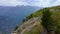 Aerial video of a family of tourists visitng the Grlo Sokolovo canyon a famous sightseeing location in Montenegro. They