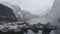 Aerial video of famous fishing village called nusfjord located in lofoten islands north of norway. Moody weather, snowing ang clou