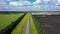 Aerial video, flying over a flat and straight highway going beyond the horizon