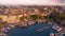 Aerial video footage from a drone. Top view from drone of harbor with yacht, motorboat and sailboat. Beautiful old port