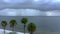 Aerial video hurricane storm approaching Miami Florida. Scene with palm trees overlooking Biscayne Bay