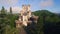 Aerial video of medieval tower in forest of rural spain