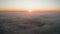 Aerial video over low clouds and beautiful sunrise