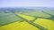 Aerial video, panorama of multicolored agricultural fields forests and villages from a high altitude.