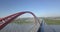 Aerial video photography of a large red Bugrinsky bridge