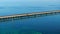 Aerial video red pick up truck driving Seven Mile Bridge Florida Keys