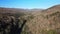 Aerial video of a remote mountain valley on a sunny day