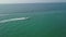 Aerial video shot with drone over the sea and beach with boat and yacht