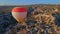 In this aerial video, the skies above Cappadocia, Turkey, come alive with a kaleidoscope of hot air balloons