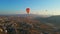 In this aerial video, the skies above Cappadocia, Turkey, come alive with a kaleidoscope of hot air balloons