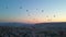 In this aerial video, the skies above Cappadocia, Turkey, come alive with a kaleidoscope of hot air balloons