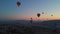 In this aerial video, the skies above Cappadocia, Turkey, come alive with a kaleidoscope of hot air balloons