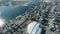 Aerial video view of Harbourfront - City Place with modern buildings the Rogers Centre, traffic moving on highway and Airport