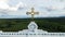 Aerial video of a yellow cross over the Lavang church roof