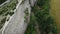 Aerial viev of lush green farm field with rocky cliffs in the distance. beauty of rural areas and the agricultural