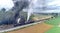 Aerial View of 2 Antique Norfolk and Western Steam Engines No. 611 and 382 Double Heading a Freight Train with Black Smoke and