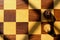 Aerial view of 2 knights facing each other on a chess board