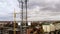 Aerial view of 4G and 5G telecommunications tower cellular network antenna on the roof of a building